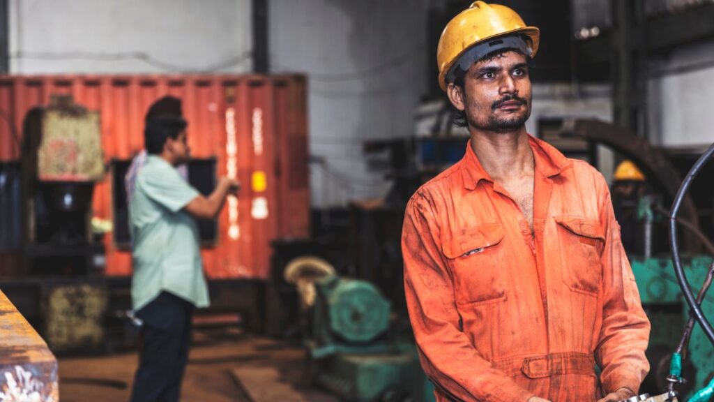 Factory worker working in manufacturing plant.